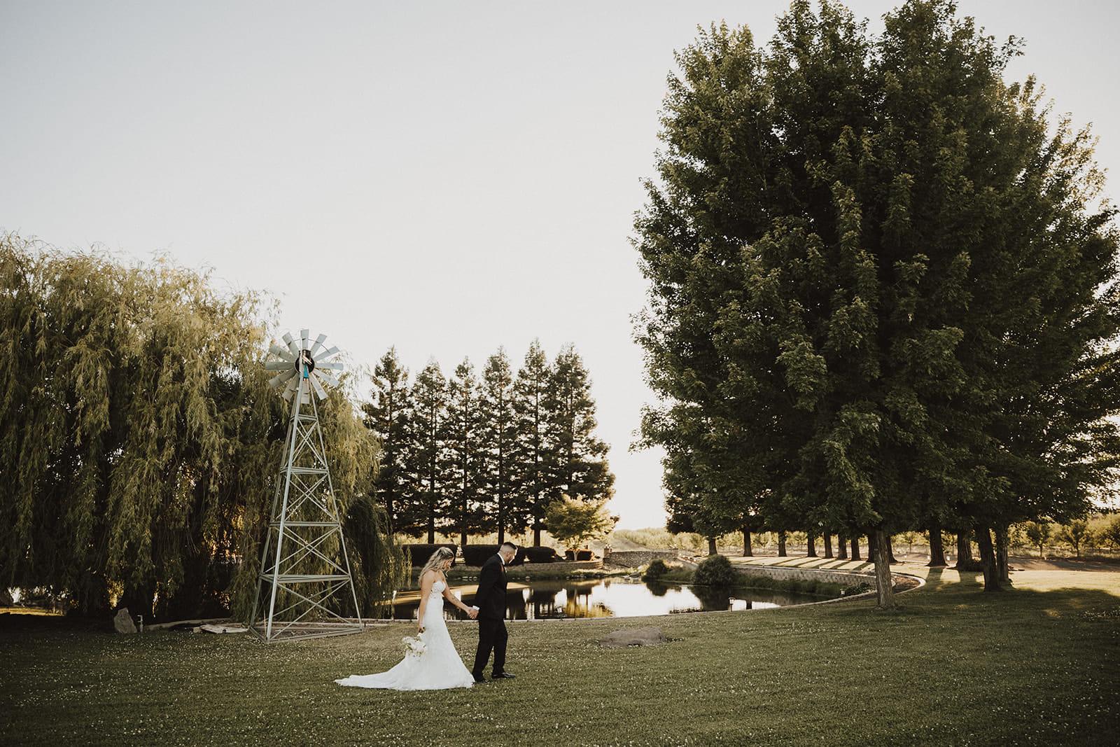 The couple dancing on the open lawn beside the windmill