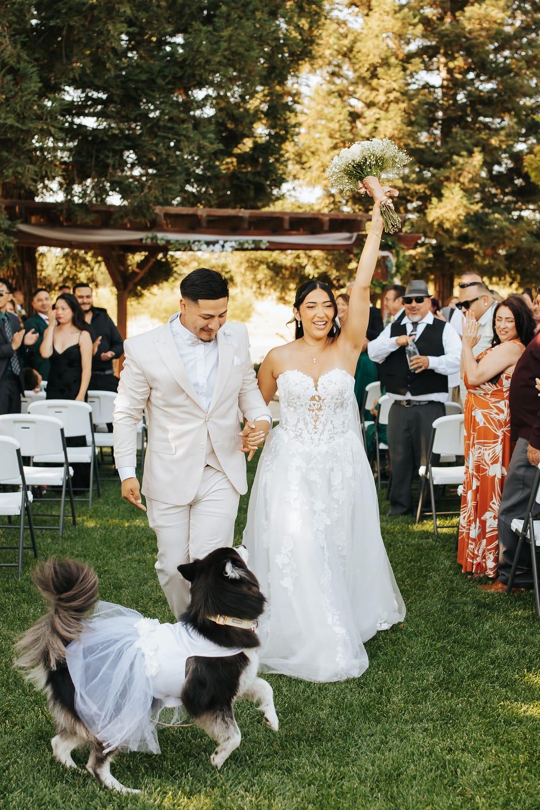 Bouquet raised high on the walk back up the aisle