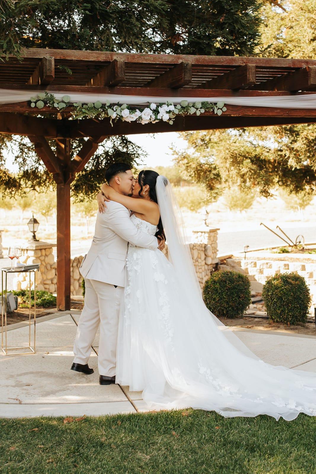The first kiss beneath the pergola
